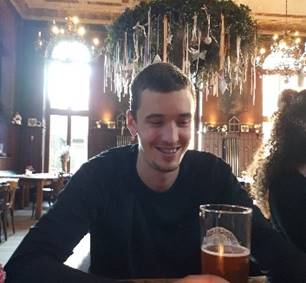 A person holding a glass of wine

Description automatically generated with low confidence